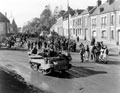 British infantry in carriers moving through the regiment at Grand Villiers, 1944