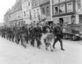 French Maquis march to lay a wreath on a local memorial, 1944