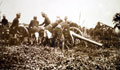 Askaris getting field gun into position, East Africa, 1914 (c)