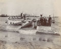 Horse boats landing on a beach with naval personnel during the simulated landings at Clacton-on-Sea, September 1904