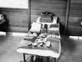 A national serviceman's kit laid out on a barrack bed ready for inspection, 1955