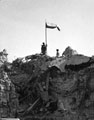 Poles of the 3rd Carpathian Division raising their flag over Monte Cassino, Italy, 1944