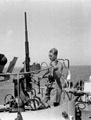 Mike Carter, 3rd County of London Yeomanry (Sharpshooters), with an Oerlikon gun, on board a 'L.S.T', Landing Ship, Tank, Operation HUSKY, 1943