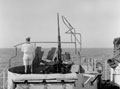 'A/A Post', a Royal Navy sailor on watch by an Oerlikon anti-aircraft gun, Operation HUSKY, 1943