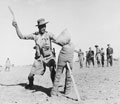 A Gurkha soldier demonstrates how to use the kukri fighting knife, 1944