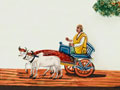 Indian man riding in a decorated bullock cart, 1860 (c)