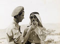 British NCO and Arab Legion NCO smoking, 1946 (c)