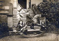 Douglas McKie and his sisters playing on a rocking horse, 1900 (c)