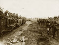 Light railway and troops moving up, 1916 (c)