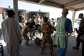 An improvised explosive device (IED) casualty arrives for treatment at Camp Bastion Hospital, 2009