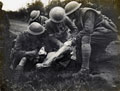 Attending to a wounded runner on the Western Front, 1917 (c)