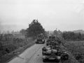 A troop of tanks passing carriers of the Dutch Brigade and moving up to assault the crossings over the dykes south of the town of Tilburg, 26 October 1944