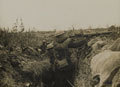 Lewis gunner on firing step of trench, 1916 (c)
