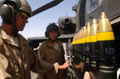 3 Army Air Corps AH64 Apache helicopter ground crew loading ammunition, Helmand Province, Afghanistan, August 2007