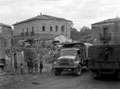 British trucks in the battle-damaged town of Bronte', Sicily, 1943