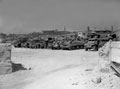 Vehicles of 3rd County of London Yeomanry waiting to load at Catania harbour, 1943