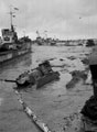 Assault craft and a partially submerged Sherman tank, Normandy, June 1944