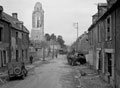'The knocked-out Panther tank and destroyed church at Bretteville-en-Orguilleuse', June 1944
