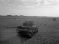 '"A" Squadron doing left protection during the attack on Mouen.The Germans still occupied Carpiquet aerodrome seen on the skyline', 3rd County of London Yeomanry (Sharpshooters), Normandy, 28 June 1944