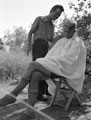 'Bill Sullivan gets a haircut', Italy, 1943