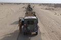 A column of Black Watch Battle Group Land Rovers halt on the move north to their new area of operations south of Baghdad, Operation BRACKEN, 29 October 2004