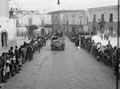 Civilians line a street in Taranto, welcoming Allied forces, Italy, 1943