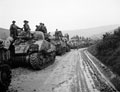 'Early morning. The Rgt. carrying infantry halted on road after heavy rain short of crossing over the R. Ofanto', 3rd County of London Yeomanry (Sharpshooters),  Italy, 1943