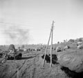 'After Luftwaffe hit & run raid. Smoke from bombing, dispersing', 3rd County of London Yeomanry (Sharpshooters), Sangro River, Italy, 1943