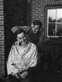 'Machen gives Harry Pitt a trim', Holland, 1944 (c)