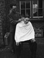 A trooper receives a haircut, 1944 (c)