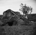 German defensive position constructed beneath a ruined Italian farmhouse, 1943.