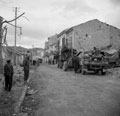 4.5 inch guns moving through Fossacesia to support the attack beyond St. Vito, Italy, 1943