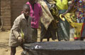 A child at the fish stall in the local farmers' market in Wisikoti, Malawi, 2002