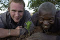 A student from Tayforth University Officer Training Corps with a local in Wisikoti, Ntchisi district in central Malawi, 2002