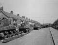 Sherman tanks being fitted with tracks in a residential street, probably Worthing, West Sussex, 1944