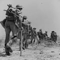 The 6th Royal Inniskilling Fusiliers moving up to the front line during the attack on Centuripe, August 1943
