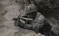 Private J Connington in action with Sten gun, Arnhem, 1944