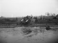 'A Buffalo containing a 6 Pounder anti-tank gun crossing the Wessem Canal', Netherlands, November 1944