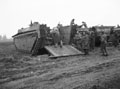 Buffalo tracked landing vehicles loading anti-tank guns before crossing the Wessem-Nederweert Canal, Netherlands, November 1944