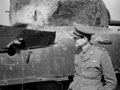 'Nearly but not quite', Major Oliver Woods MC, 3rd/4th County of London Yeomanry (Sharpshooters), examines a shell hole in his Sherman tank, Uedem, Germany, 1945