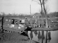 Captain Phillip Millington, Royal Horse Artillery, testing a Weasel amphibious vehicle in a duck pond near 'A' Squadron, 3rd/4th County of London Yeomanry (Sharpshooters)'s leaguer, Uedem, Germany, 1945