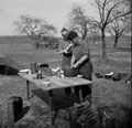 'Cpl. Pearman amd Cpl. Munn preparing their dinner', 3rd/4th County of London Yeomanry (Sharpshooters), Germany, 1945