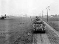'B' Squadron Sherman tanks moving up through the glider landing zone, Germany, 1945