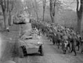 Passing prisoners of war when moving up to the Aller, Germany, April 1945