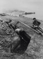1st Battalion,7th Gurkha Rifles, digging a defensive position on the shore of San Carlos Bay, Falkland Islands, 1982
