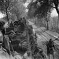 Prisoners of war passing tanks of 'C' Squadron while waiting to cross the Elbe, 1945