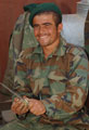 An Afghan National Army soldier peeling potatoes at Camp Tombstone, 2006