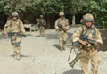 Heavily armed soldiers from 3rd Battalion The Parachute Regiment begin the move out of Musa Qala, 2006