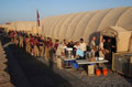 A large queue outside 3rd Battalion The Parachute Regiment's dining hall at Camp Bastion, Afghanistan, 2006