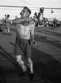'Jenner Jones', playing deck tennis, 3rd County of London Yeomanry (Sharpshooters) on board HMT Orion en route to Egypt, 1941